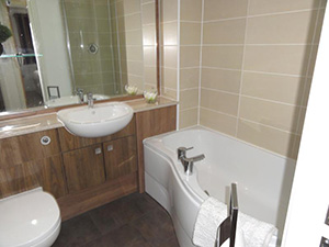 Saddlery Way - Bathroom has an electric shower over the bath.